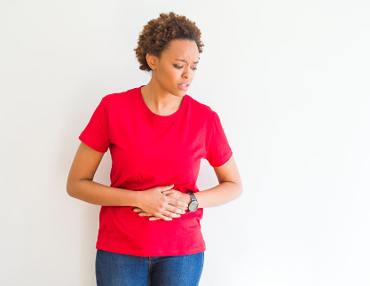 woman holding her stomach